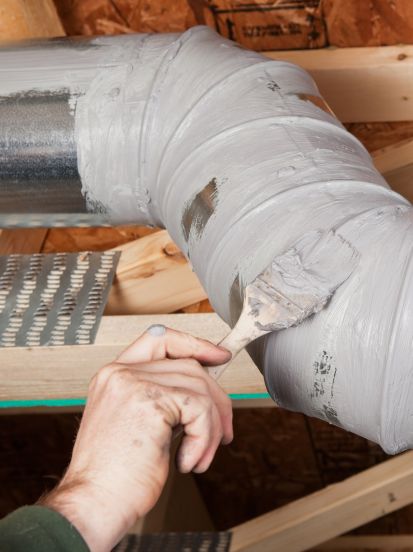 Custom ductwork installation and aerosol sealing to improve airflow and energy efficiency.
