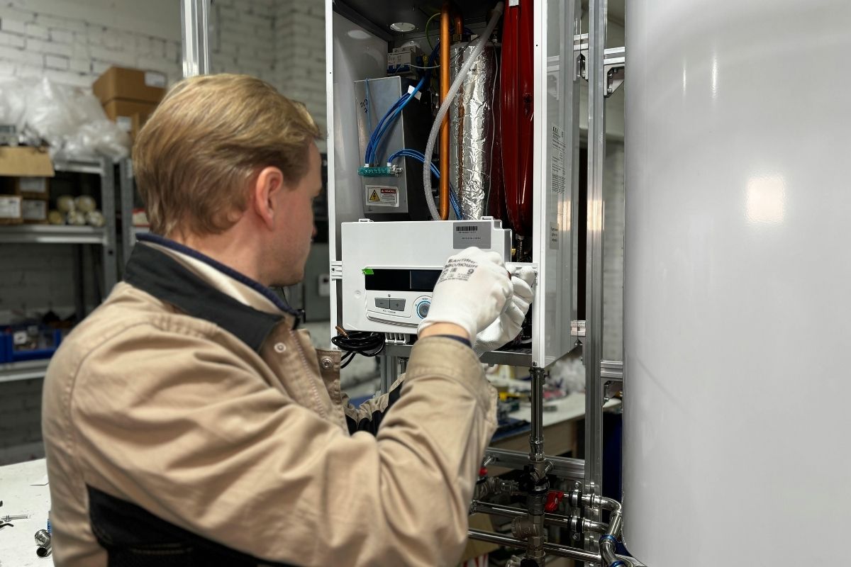 Licensed technician installing a high-efficiency gas boiler for a residential home in Westchester.
